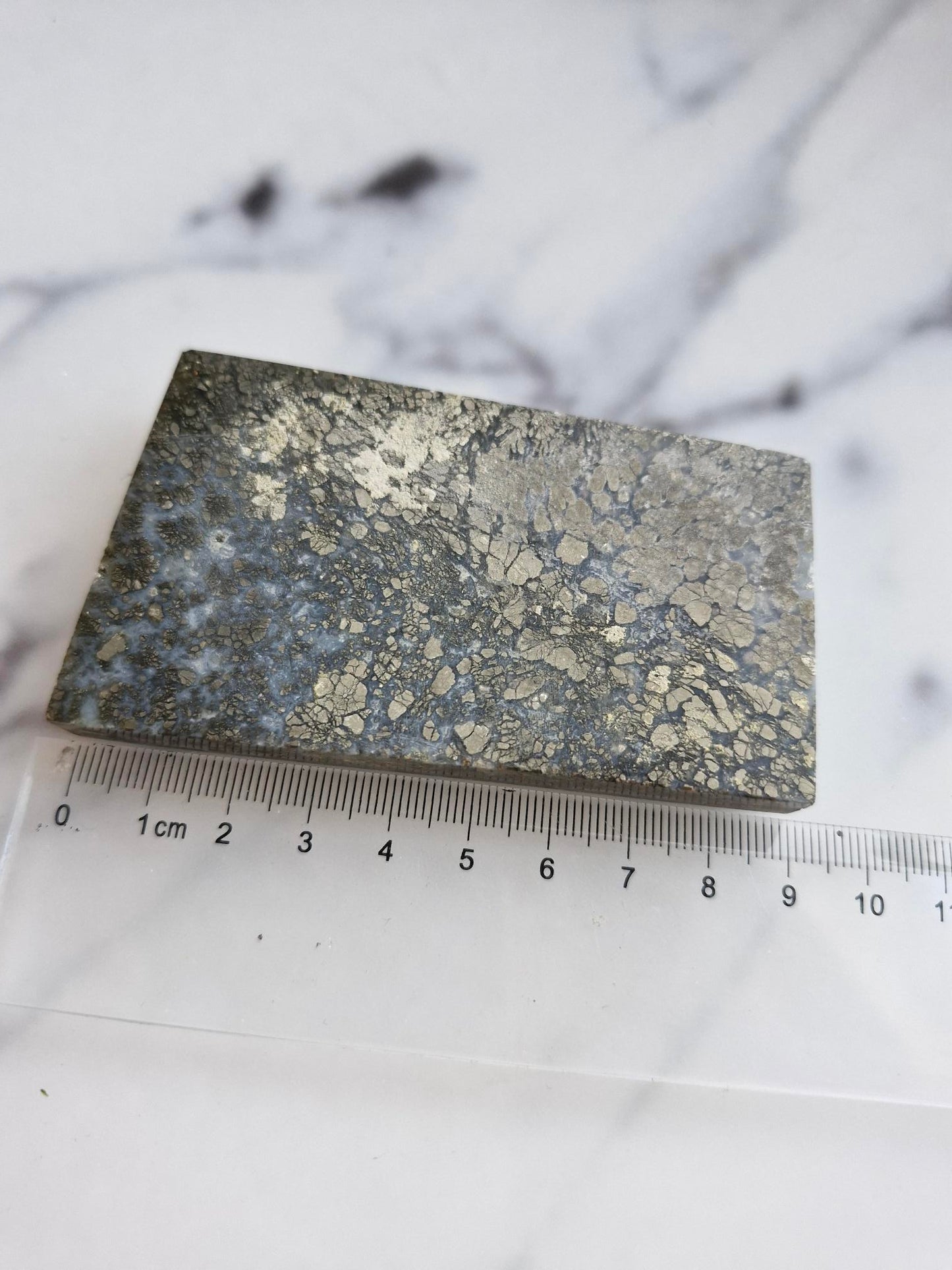 Amazing slab featuring golden pyrite/marcasite with 'flower' textures and healed fractures with pale blue banded quartz infills