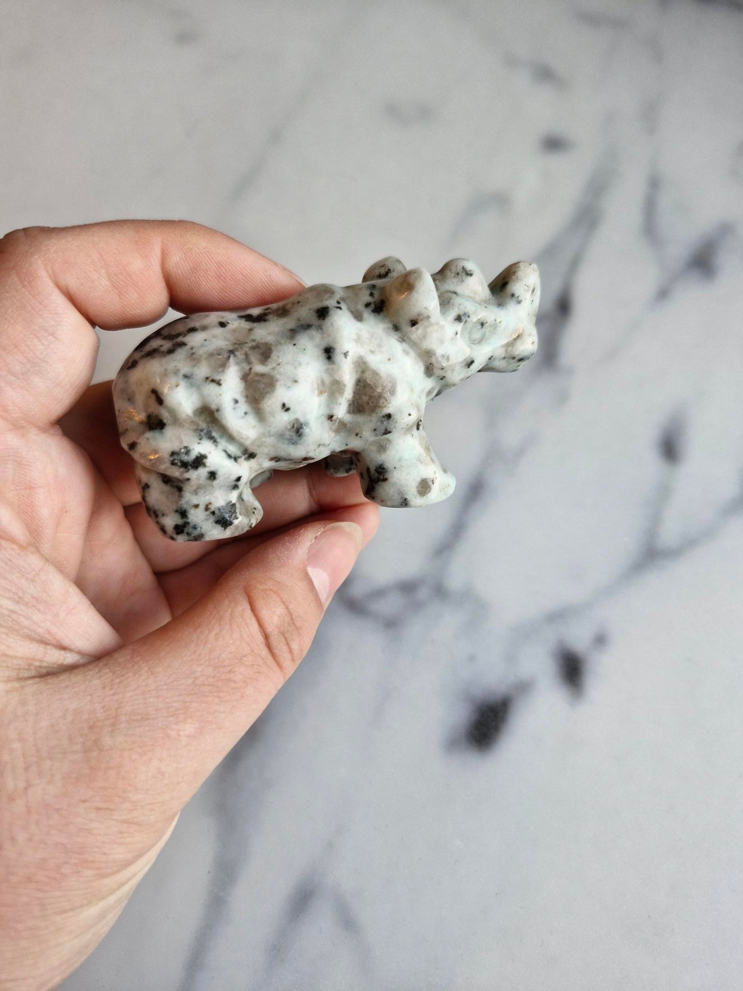 Kiwi Jasper Rhinoceros Carving With Smokey Quartz