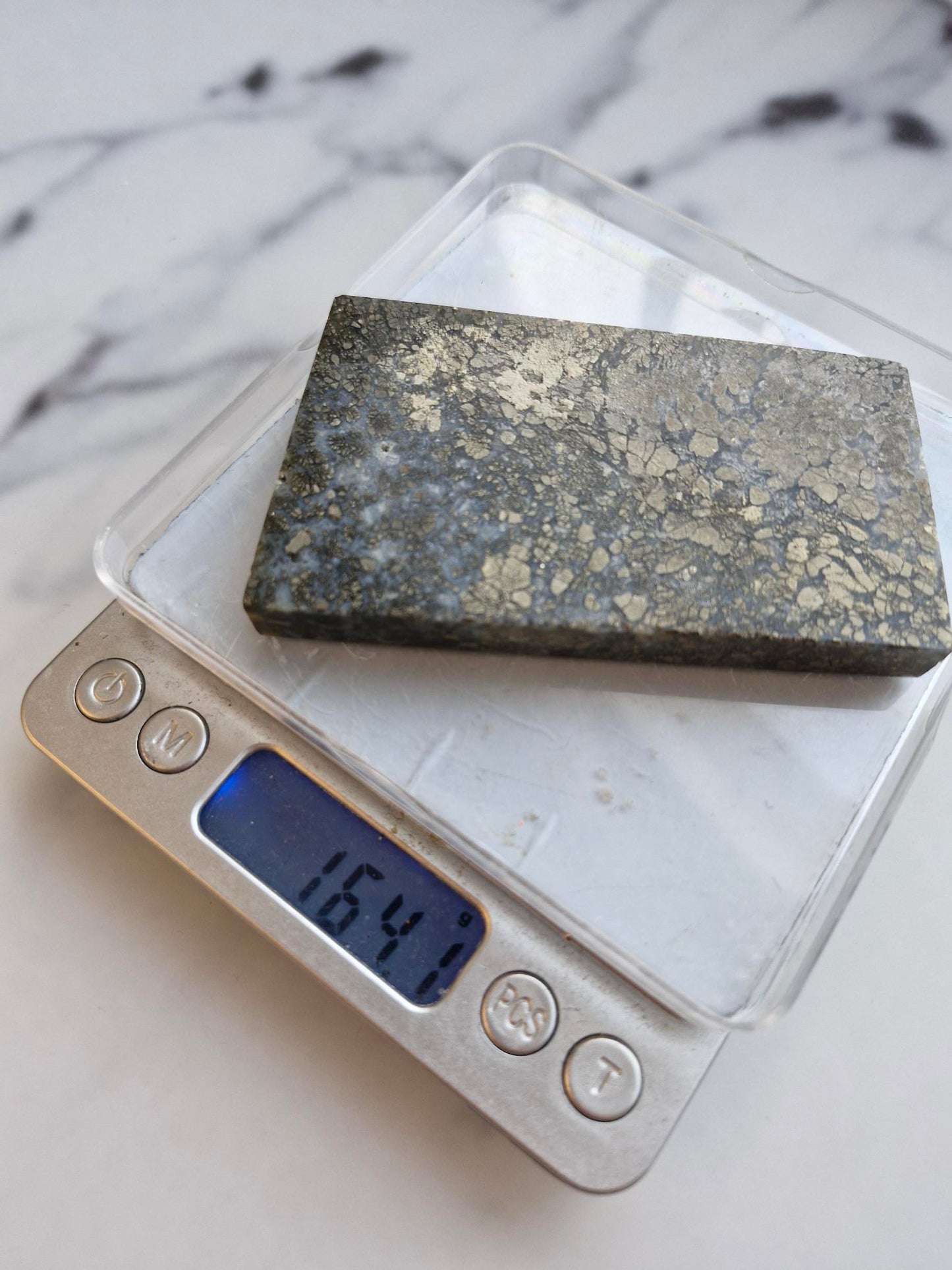 Amazing slab featuring golden pyrite/marcasite with 'flower' textures and healed fractures with pale blue banded quartz infills