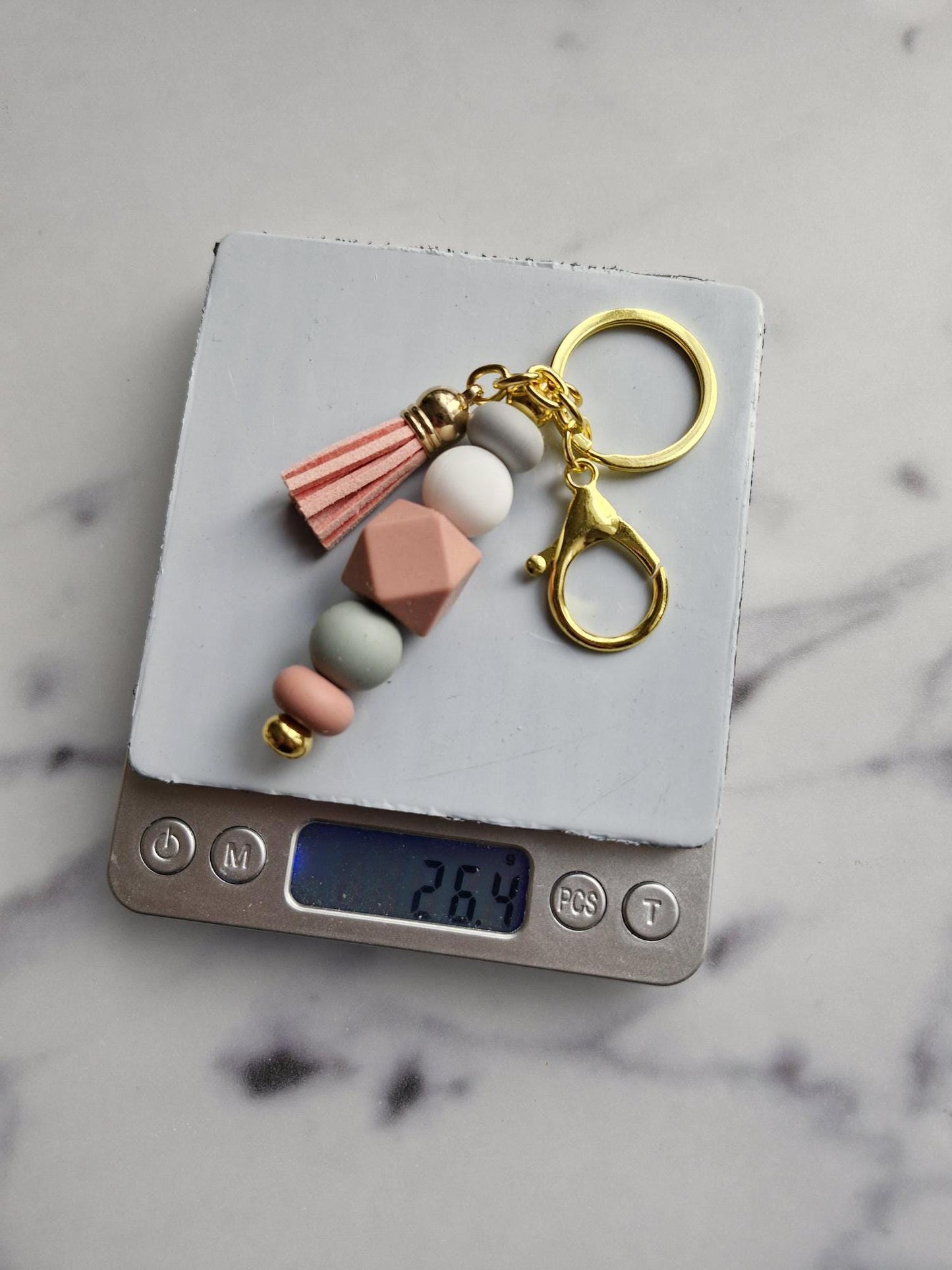 One (1) Gorgeous Unique Golden Keychain with Silicone Beads And A Tassel