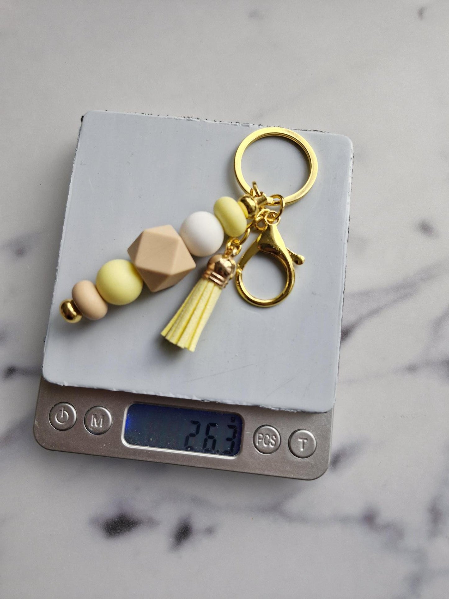 One (1) Gorgeous Unique Golden Keychain with Silicone Beads And A Tassel