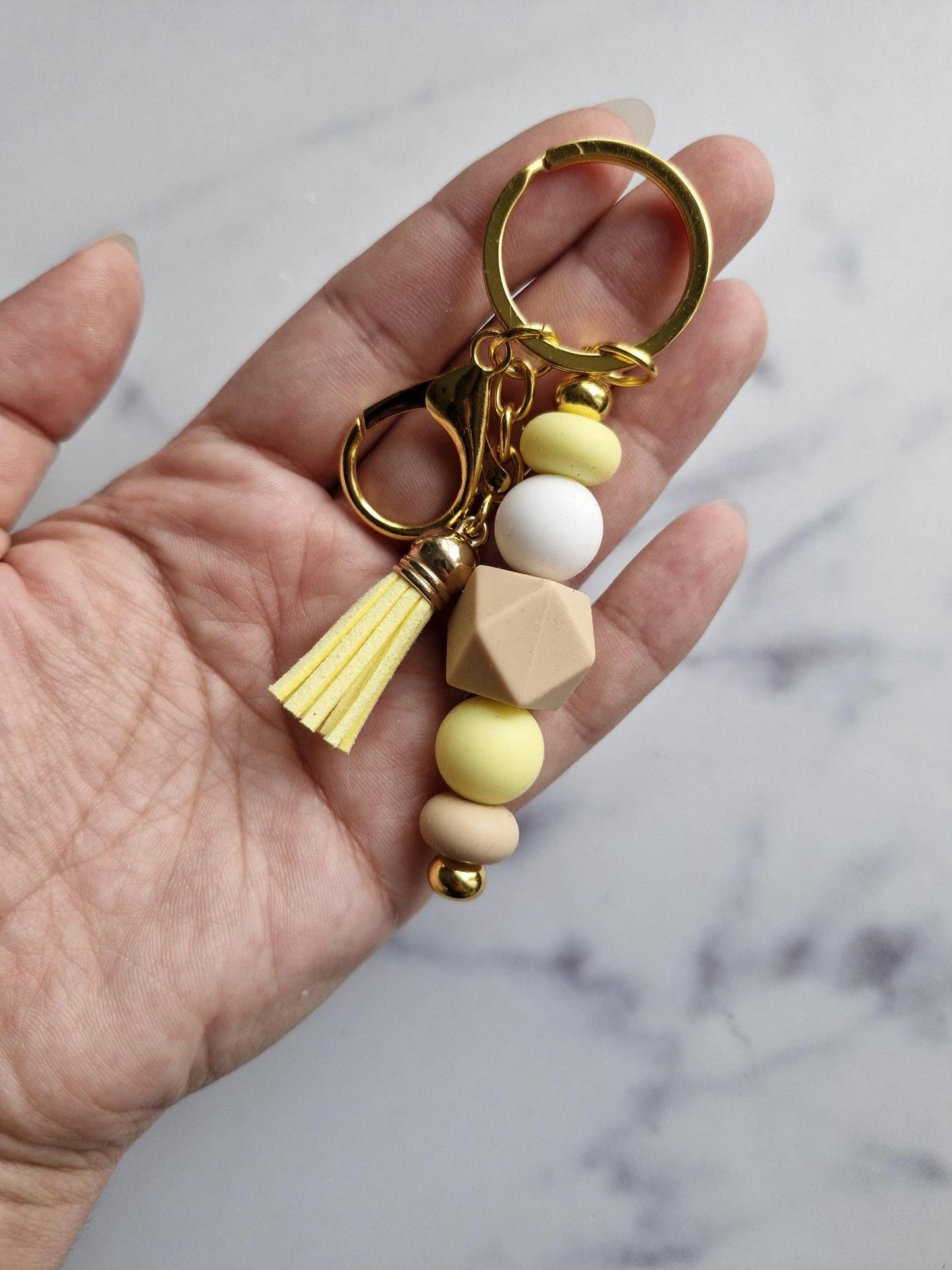 One (1) Gorgeous Unique Golden Keychain with Silicone Beads And A Tassel