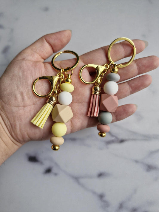 One (1) Gorgeous Unique Golden Keychain with Silicone Beads And A Tassel